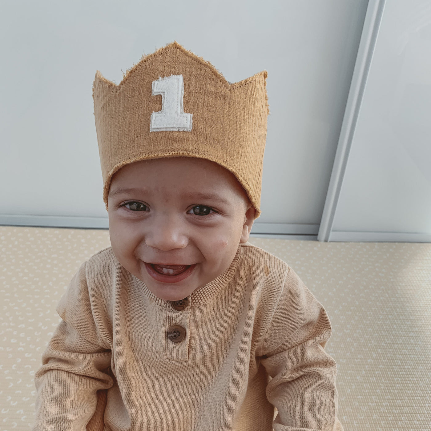 1 year old wearing a first birthday crown in tan and white - boho themed
