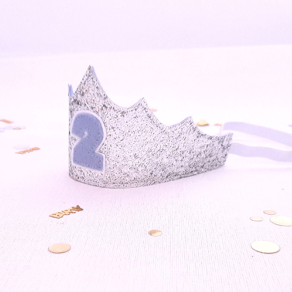 2nd birthday crown silver glitter and pale blue number 2 on the front