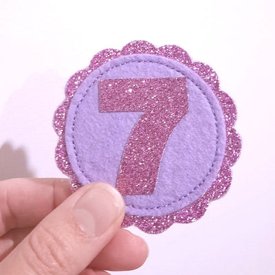 7th birthday badge in purple glitter and lilac felt