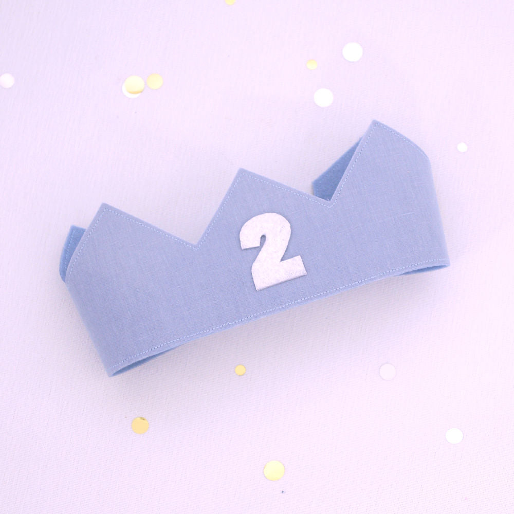 blue linen second birthday crown for a boy with silver 2 on the front
