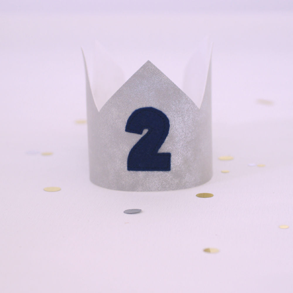 silver birthday crown with blue number 2 on the front