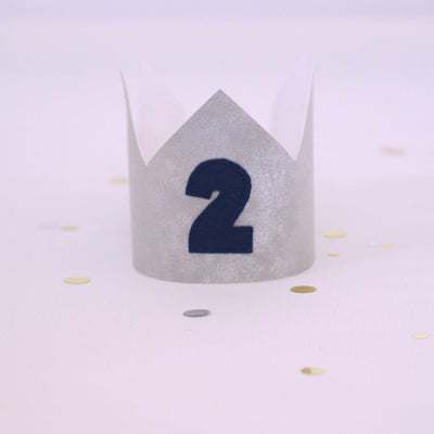 silver birthday crown with blue number 2 on the front